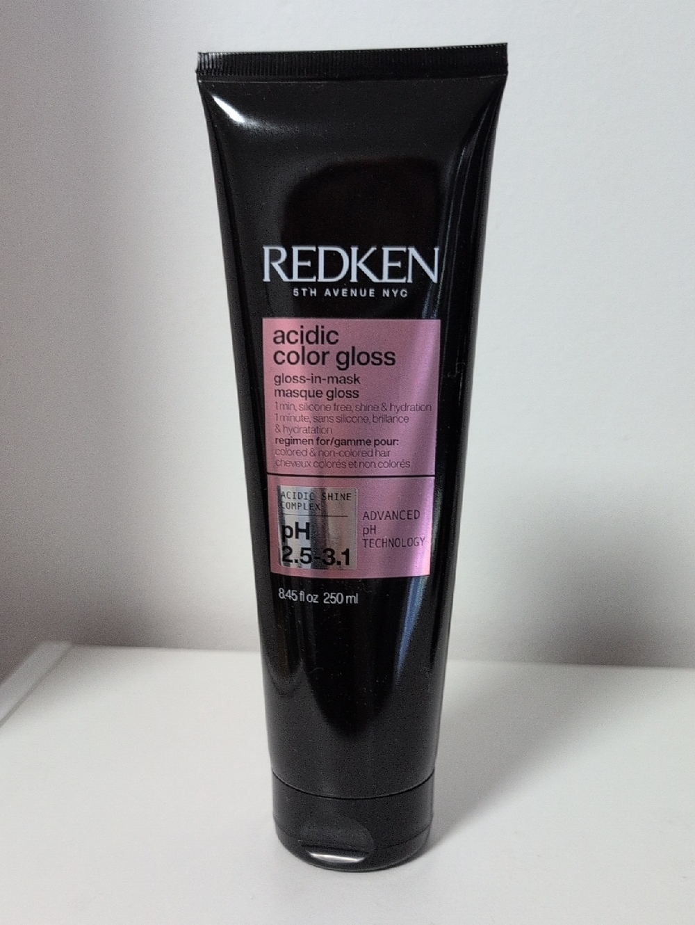 Redken Acidic Color Gloss Tube in Black with Pink Label